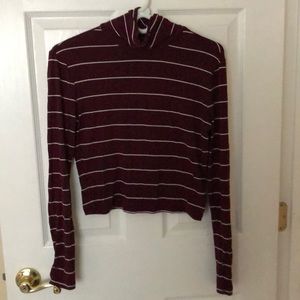 Striped turtle neck shirt.